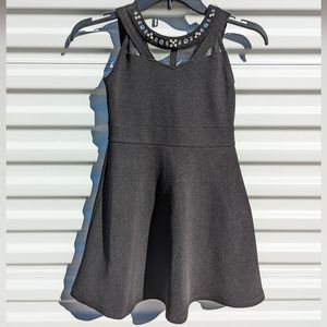 Place Black for and flare dress with rhinestones at neckline